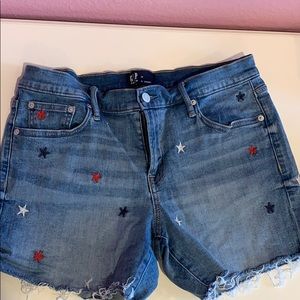 Denim shorts. Embroidered stars.